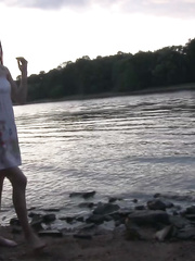 Nude legged cutie hikes her suit in order to take a pee on the beach