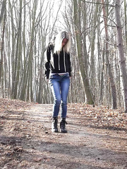 Golden-Haired playgirl Claudia Macc pyulls down jeans for a pee on path in the forest