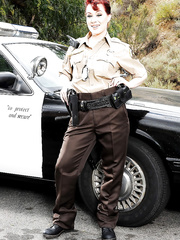 Redhead pornstar hottie Jessica Ryan disrobes off police uniform outdoors