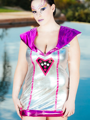 Tattooed model Axis Evol showing her thick body and large a-hole by the water