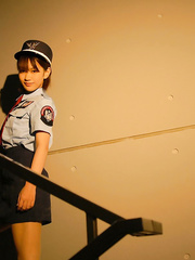 Oriental policewoman Riina has her breasts caressed whilst disrobing