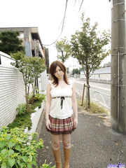 Cute Japanese gal Nami Ogawa flashes upskirt pants outside previous to disrobing