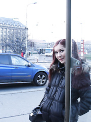 Playful redhead chick flashing her shapely wobblers in a public place