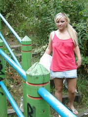 Bulky UK female with golden-haired hair disrobes nude on a popular walking trails