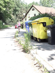 Golden-Haired angel in need a urinate squats on the sidewalk to empty her bladder