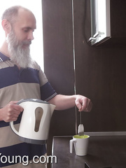 Tattooed legal age teenager seduces and bonks her stepfather's father in the kitchen