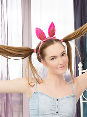 Juvenile looking legal age teenager shows her palatable vagina in pink bunny ears and knee socks