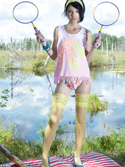 Black haired legal age teenager beauty lays down her badminton rackets and undresses exposed