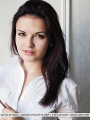 Pretty brunette hair filly Dulcia likes stripping and stretching her muff
