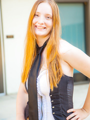 Pale redhead Julia Fleming wraps her great love bubbles around umbrella pole