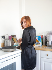 Dilettante redhead Chesea Bell sheds her dark satin robe to cook in the undressed