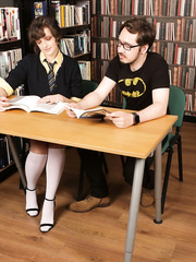 Nerdy chicks disrobe and jerk off a boyfrend nerd in the library