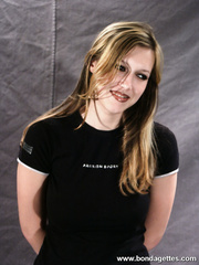 Restrained golden-haired beauty is coercive into having to smoke a cigarette