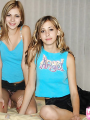 Ribald blond beauties takes off their clothing at the same time on a daybed