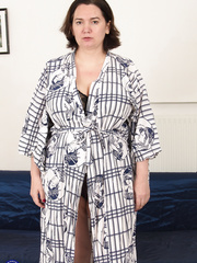 Thick mature woman removes robe and underware previous to riding her paramour's rod