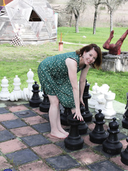 Chunky older lady toys her snatch in tan nylons on chesterfield