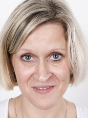 Older woman crosses her legs after removing all of her garments