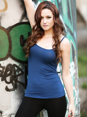 Dilettante model Hayden Ryan slides dark leggings over matching strap and her arse