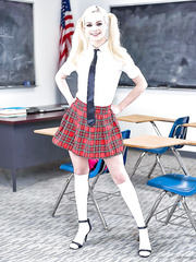Pornstar Elsa Jean stripping off schoolgirl uniform to pose nude in socks