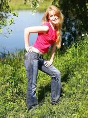 Slim juvenile dilettante Alina sheds jeans & cotton pants outdoors to pose exposed