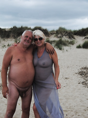 Older golden-haired Dimonty eats an ice jizz treat after naked modeling at the beach