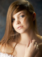 Erotic  redhead removes her lace pants to squat nude