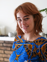 Natural redhead Molly Broad pets her twat after getting in nature's garb