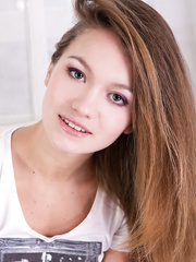 Hawt redhead European in jeans undressing to show off hairless pussy close up