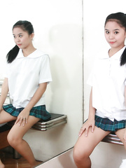 Barely legal Oriental schoolgirl with full pointer sisters showcases her cum-hole on sofa