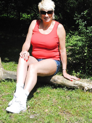 Hawt aged golden-haired Dimonty cups her large naturals during the time that going topless