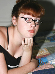 Cumbrous nerd with red hair takes off her glasses after uncupping large naturals