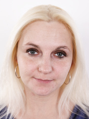 Large titted blond stands still during the time that going from dressed to absolutely exposed