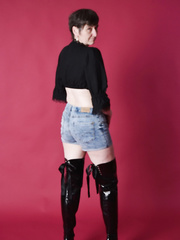 Brazen older mommy discloses saggy breasts & drops shorts to pose bare in boots