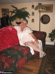 Chunky granny takes off lace underware to model in nature's garb in OTK stockings