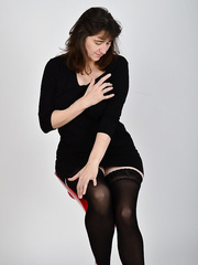 Older woman in darksome nylons & heels displaying her petite saggy tits