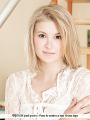 Youthful blond gal Alisha removes white belt to model completely stripped