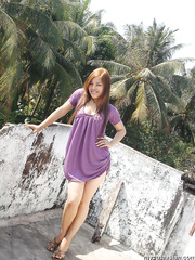 Oriental teenager wander around her village in short dresses or shorts