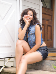 Erotic doxy Alexis in shorts teasing with her nude large mounds on the step