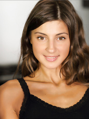 Solo cutie with a nice-looking face removes USA themed jean shorts to model in nature's garb