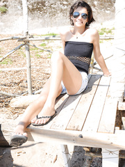 Skinny legal age teenager Tina receives absolutely undressed on a sandy beach by the ocean