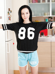 Solo beauty with dark hair fingers her shaved love tunnel after working out