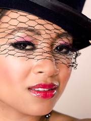 Oriental model Kina Kai dons a top hat to show her pussy in darksome nylons