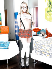 Blond nasty beauty Dakota James in petticoat undresses strap to show large arse