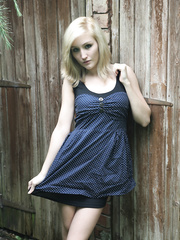 Golden-Haired dilettante Rachelle Summers does a hawt striptease against wood fence