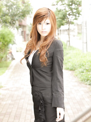 Breathtaking Oriental hotty Rina Kikukawa positions seductively fully dressed outoors