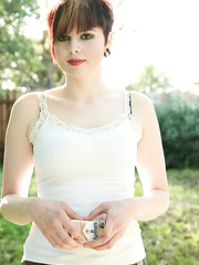 Short haired cutie Morna flashes love bubbles and bawdy cleft whilst smokin' in backyard