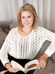 Youthful golden-haired gal Elza A makes her exposed modeling debut in over the knee socks