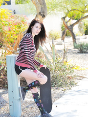 Dark Brown skater boards topless down the street & drops shorts to flash arse