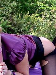 Clotehd blondes engulf off a big shlong out on the lawn amid some foilage