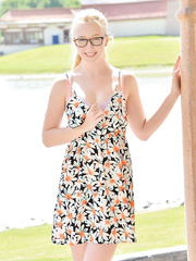 Juvenile nerd gal hikes her suit and plays with her muff in a public place